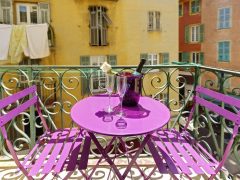Location de vacances Nice - Seau à champagne sur la table du balcon